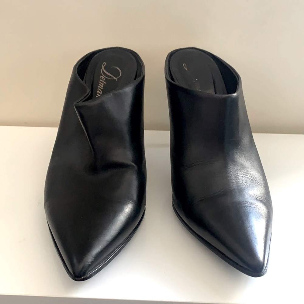 Delman Black leather shoes with metal heels.